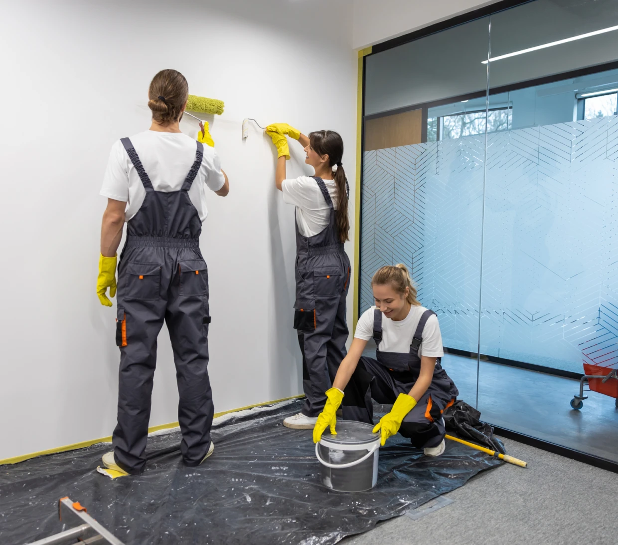 Team painting interior walls
